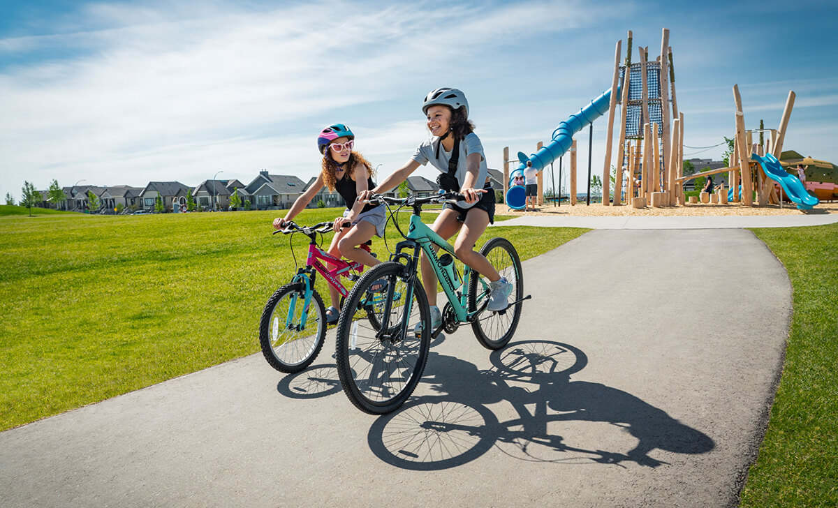 Two girls riding their bicycles